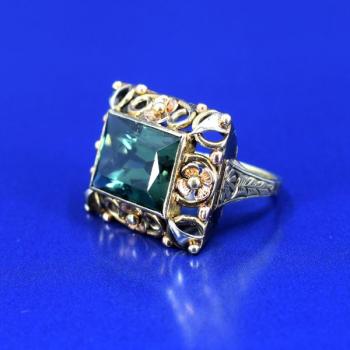Gold ring with green stone Gold ring with green stone