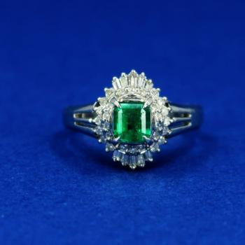 Platinum ring with diamonds and emeralds